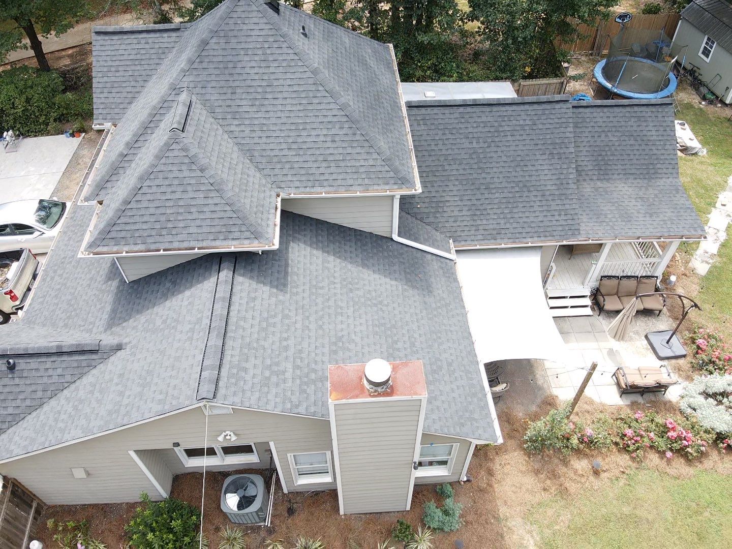 Completed roof with new shingles — aerial side view